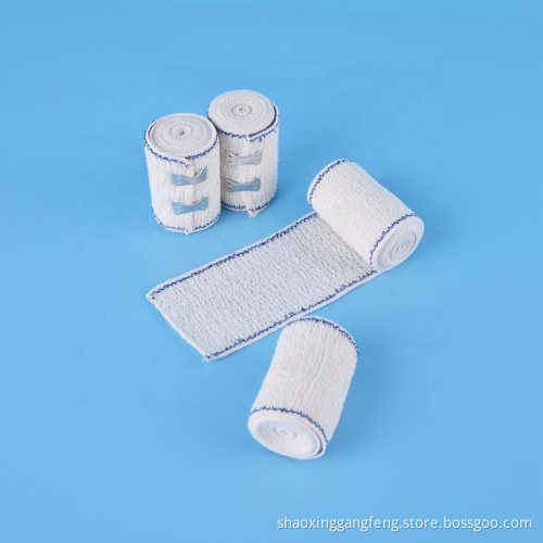 Absorbent elastic crepe bandage with blue/red line